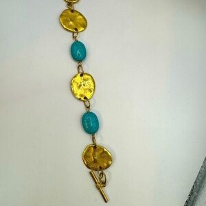 Artisan turquoise and gold tone link bracelet with toggle closure